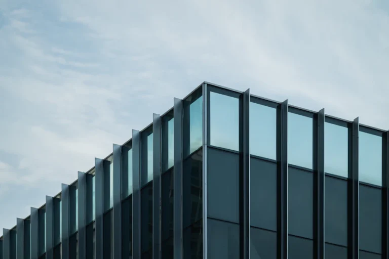 Glass and steel commercial building against the sky